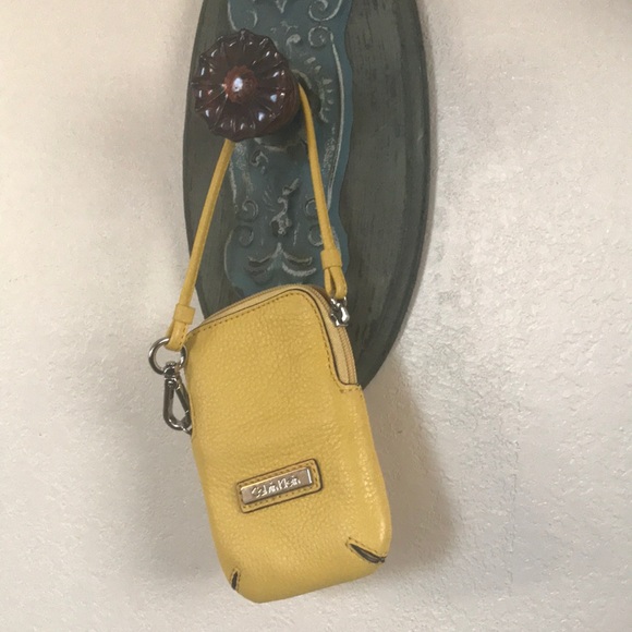 Calvin Klein Handbags - Calvin Klein Yellow Leather Wrislet Pouch